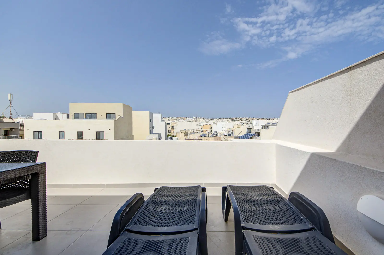 Swieqi Penthouse front terrace with sun loungers